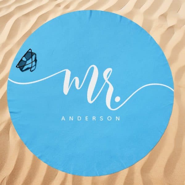 Light Blue Round Beach Towel With Mr. Anderson In White Cursive Lettering.