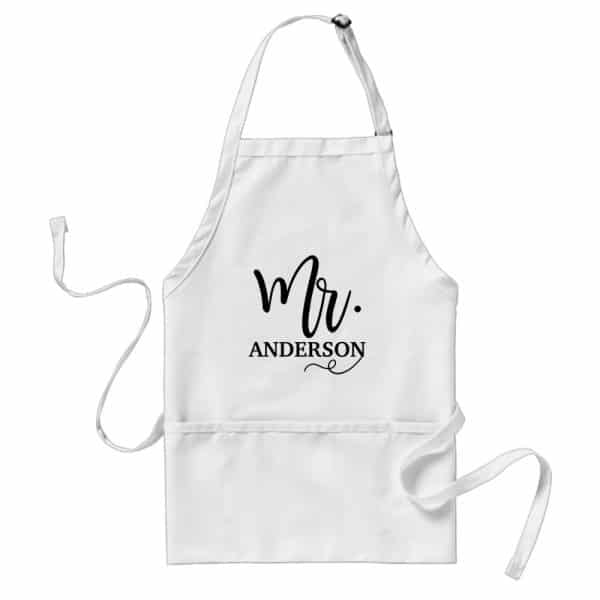 White Apron With Black Script Lettering That Says Mr. Anderson.