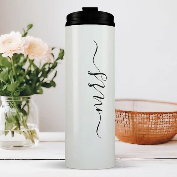 White Travel Tumbler With Black Lid And The Word Nurse In Elegant Script.