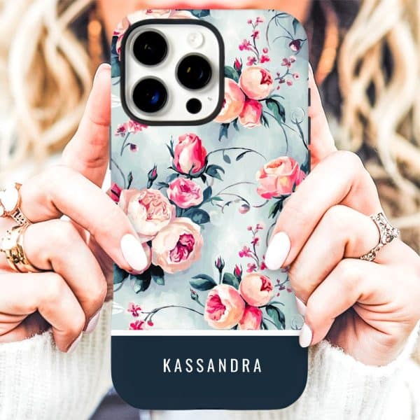 A Woman'S Hands Hold A Phone Case With A Floral Design And The Name Kassandra.