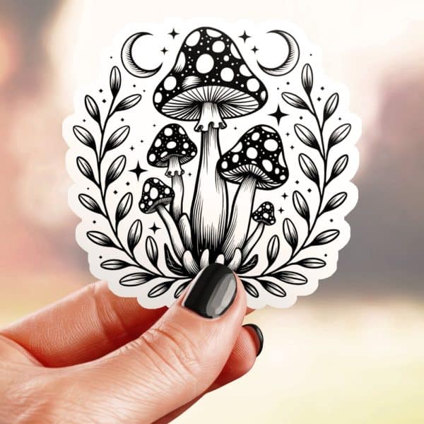 Black And White Sticker Of Several Mushrooms With Crescent Moons And Stars In A Leafy Wreath.