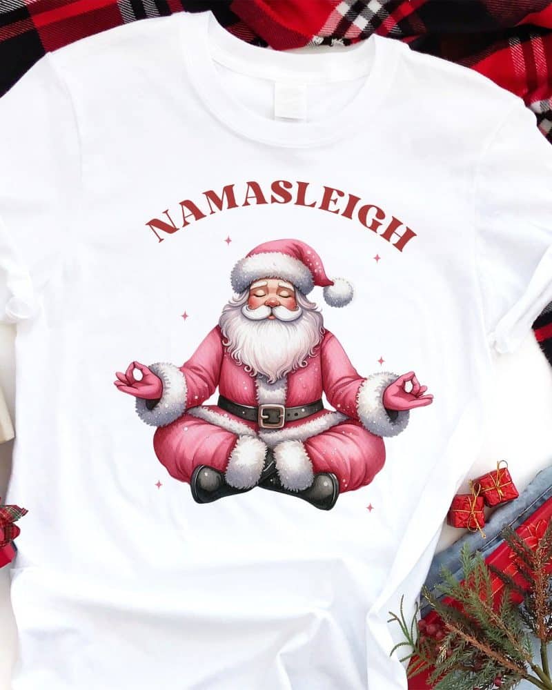White t-shirt with a meditating Santa Claus illustration and Namasleigh text.