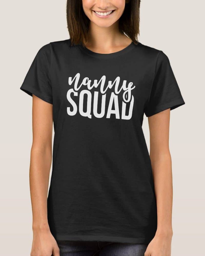 Woman wearing a black t-shirt that says Nanny Squad in white lettering.