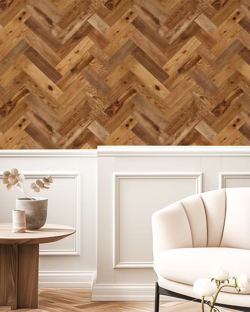 A wall featuring a herringbone wood-pattern wallpaper.