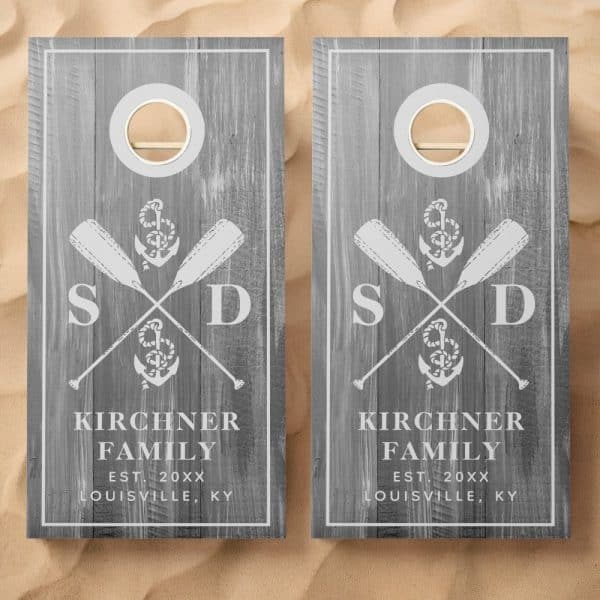 Pair Of Gray Wooden Cornhole Boards With A Nautical Theme. Each Board Features Crossed Oars, An Anchor, And The Kirchner Family Name And Location.