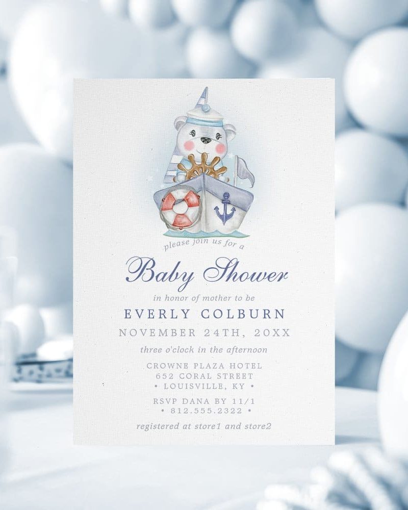 Baby shower invitation featuring a watercolor illustration of a bear in a sailor hat captaining a sailboat.