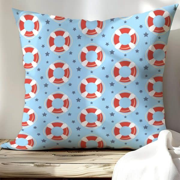 Light Blue Square Pillow With A Repeating Pattern Of Red And White Life Preservers And Small Stars.