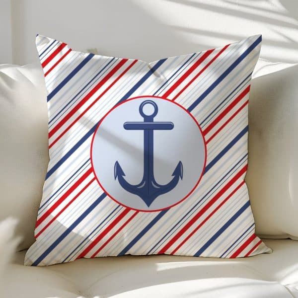 Throw Pillow With A Nautical Theme; Red, White, And Blue Diagonal Stripes And A Navy Blue Anchor In A Light Blue Circle.