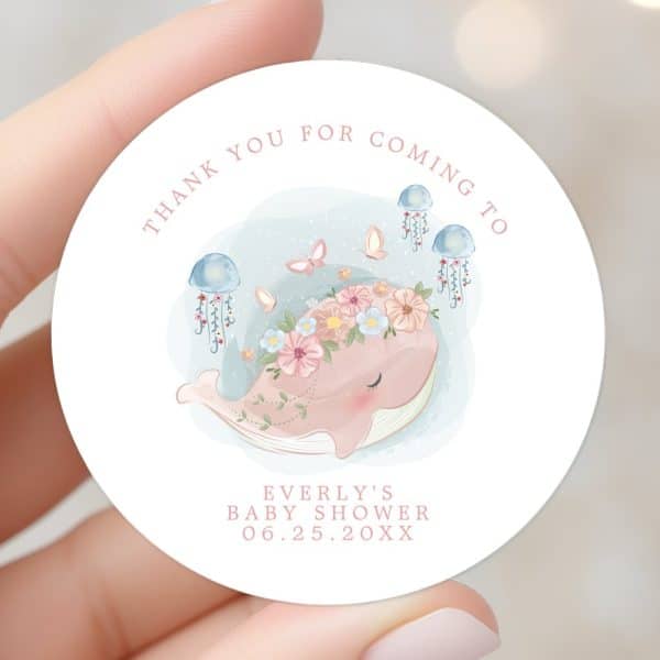 Round Baby Shower Thank You Sticker Featuring A Pink Whale Wearing A Flower Crown, Surrounded By Jellyfish And Butterflies. The Text Includes Everly'S Baby Shower Date.