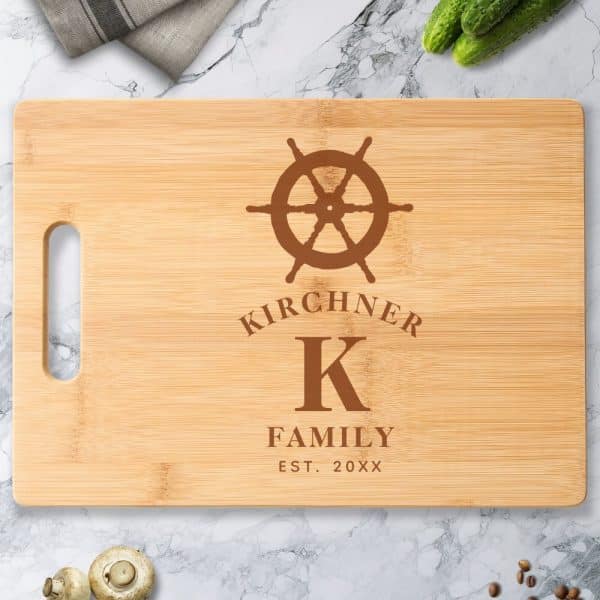 Personalized Bamboo Cutting Board With A Ship'S Wheel Design, The Letter K, And The Kirchiner Family Name.
