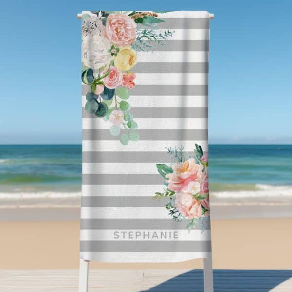 Personalized Gray Striped Beach Towel With A Watercolor Floral Design And The Name Stephanie.