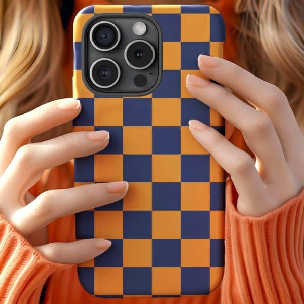 Hands Holding A Phone In A Blue And Orange Checkered Case.