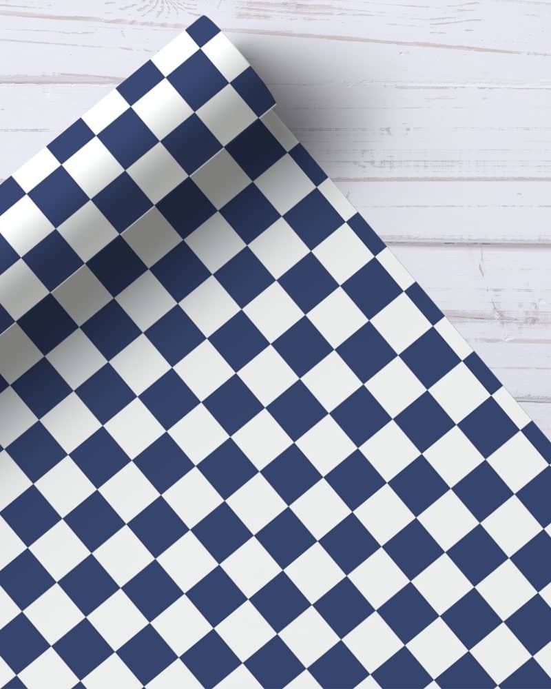 A roll of navy blue and white checkered wrapping paper.