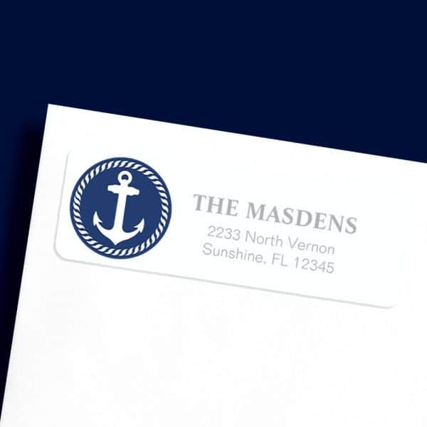 White Return Address Label With A Navy Blue Circle Containing A White Anchor. The Masdens Address Is Printed Below.