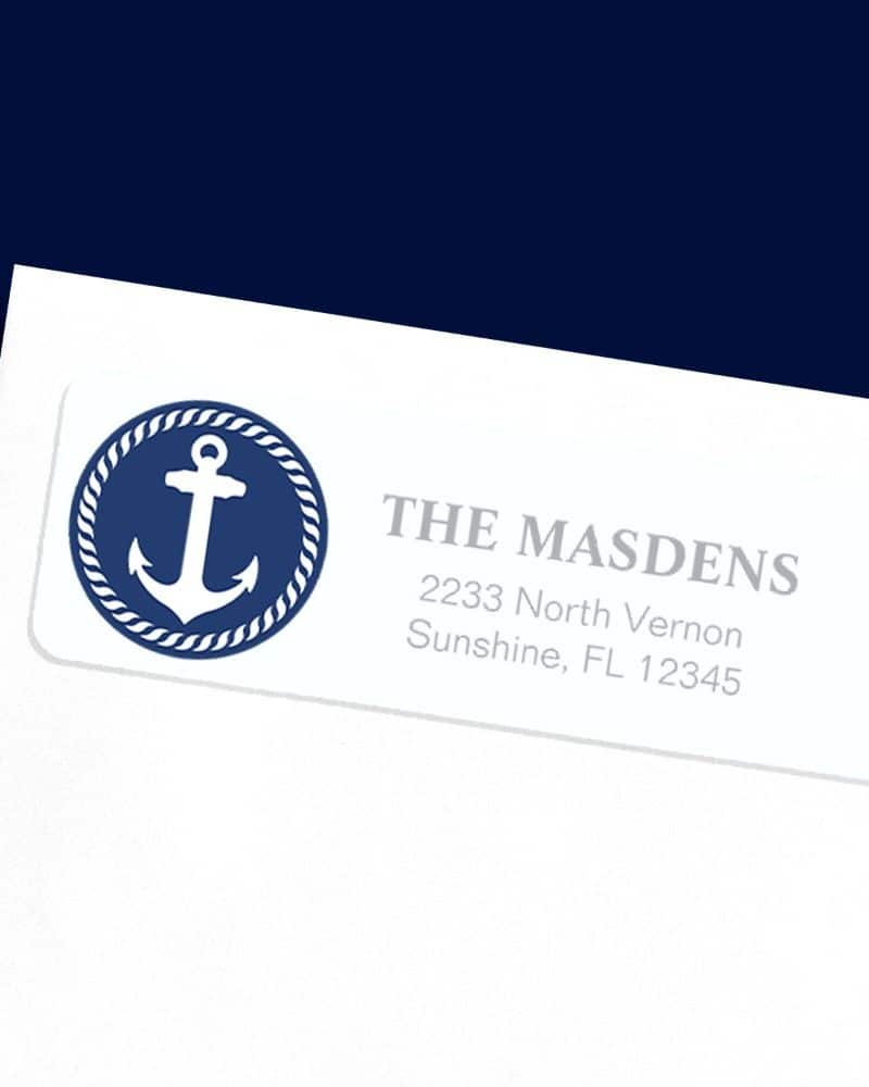 White return address label with a navy blue circle containing a white anchor. The Masdens address is printed below.