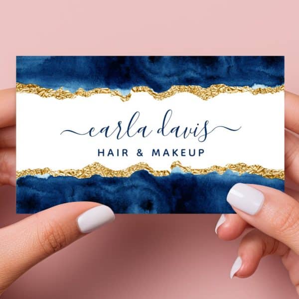 Business Card For Carla Davis Hair &Amp; Makeup, Featuring A Navy Blue Watercolor Design With Gold Foil Accents.