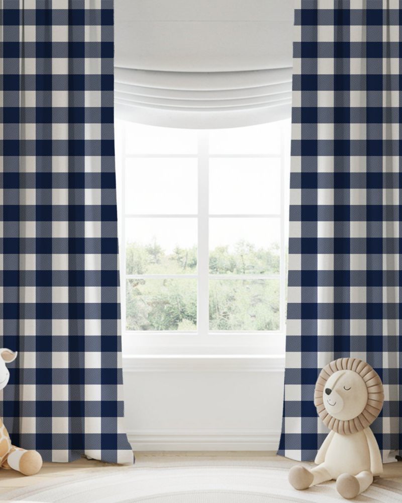 Pair of navy blue and white gingham curtains hanging in a window.