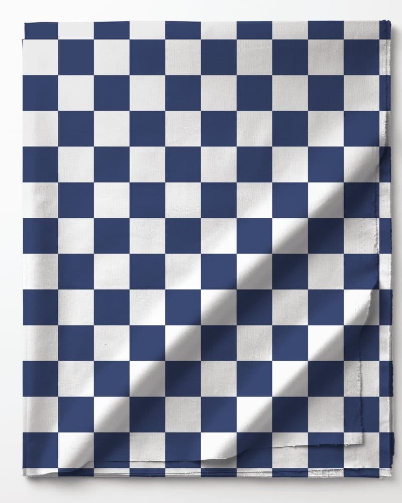 Navy blue and white checkered fabric folded on a white background.