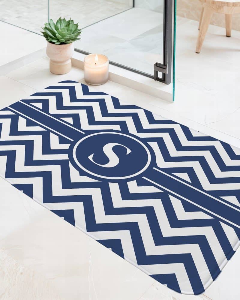 Navy blue and white chevron bath mat with a monogrammed initial S.