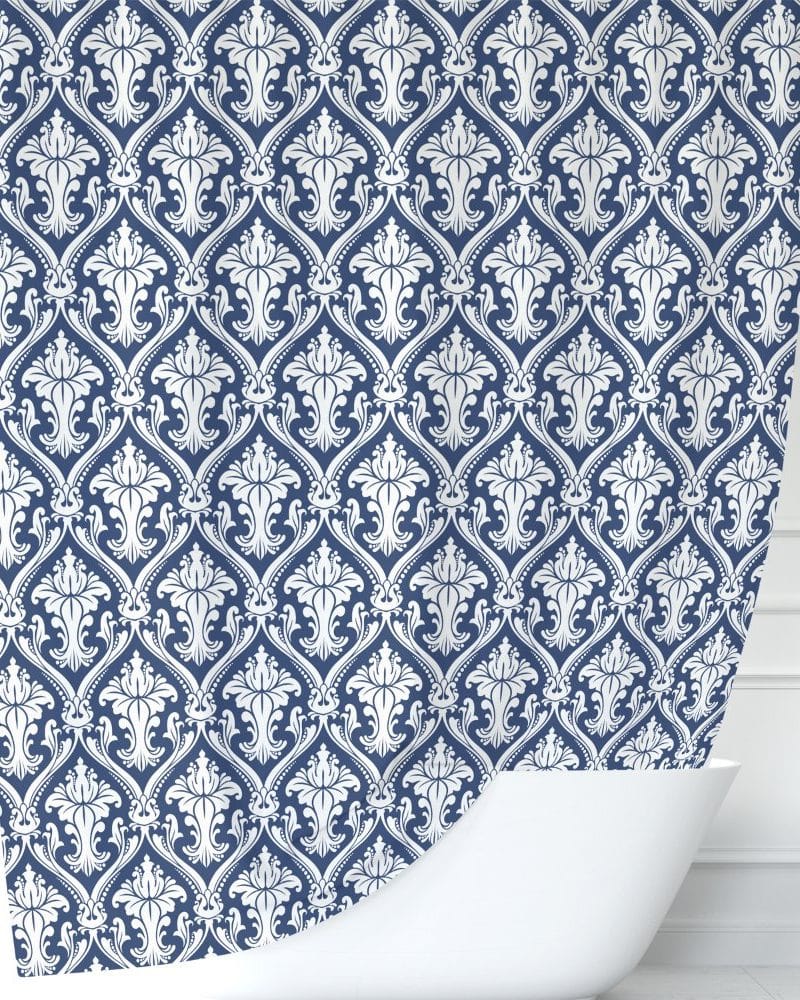Navy blue shower curtain with a white damask pattern.