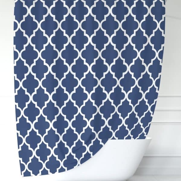 Navy Blue Shower Curtain With A White Quatrefoil Pattern.