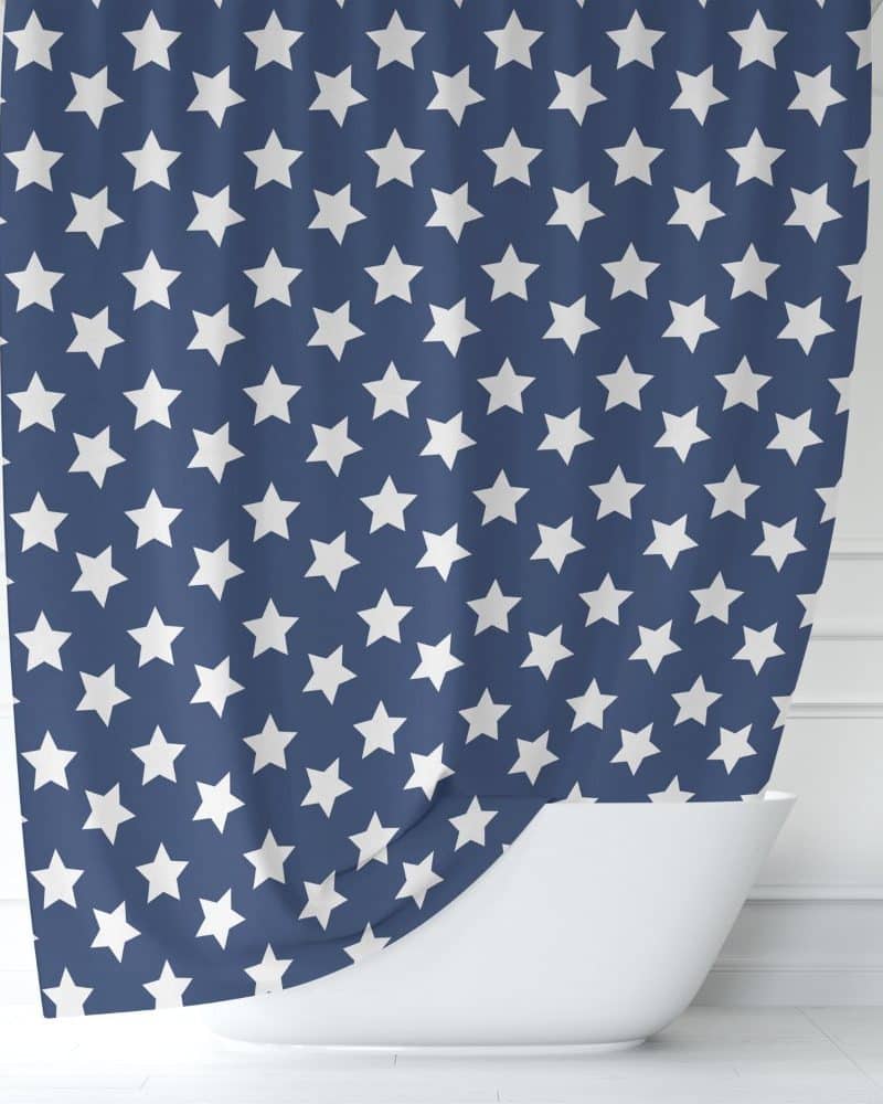 Navy blue shower curtain with a repeating pattern of white stars.