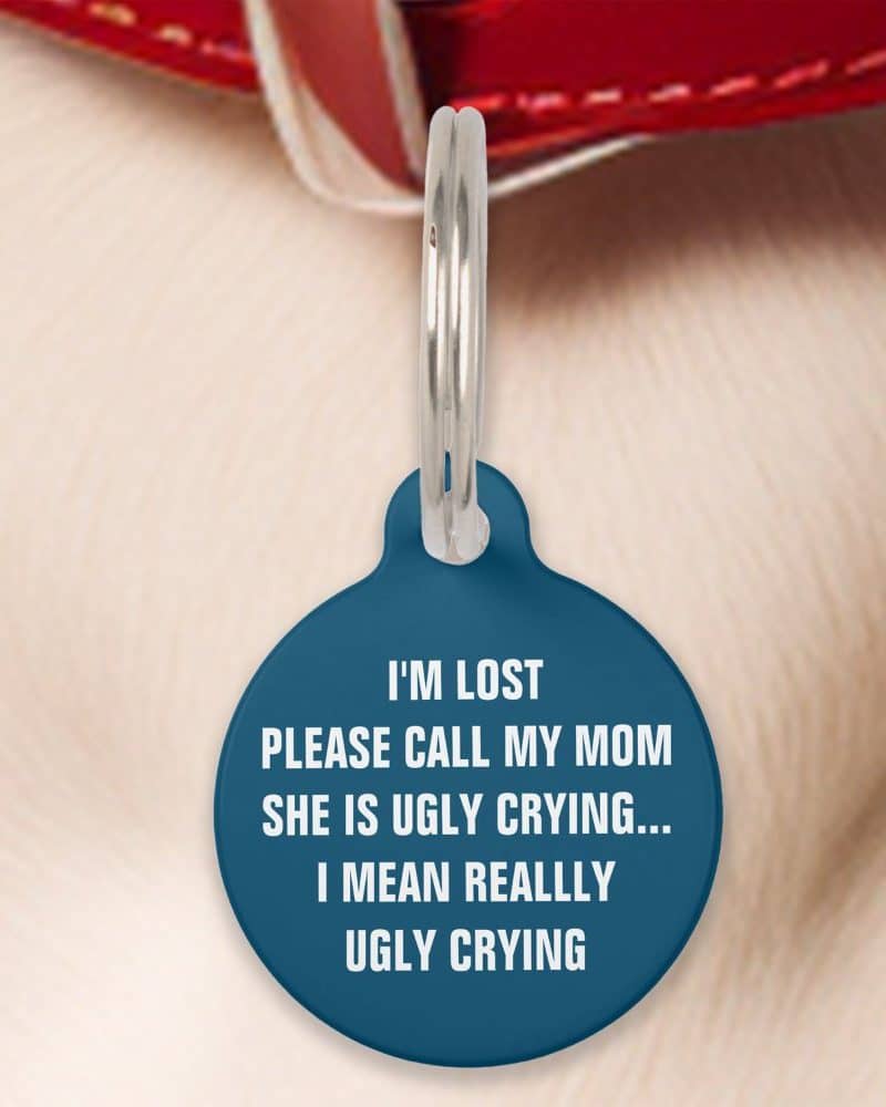 Round dark blue pet ID tag with white text that reads: I'm lost, please call my mom, she is ugly crying... I mean really ugly crying.
