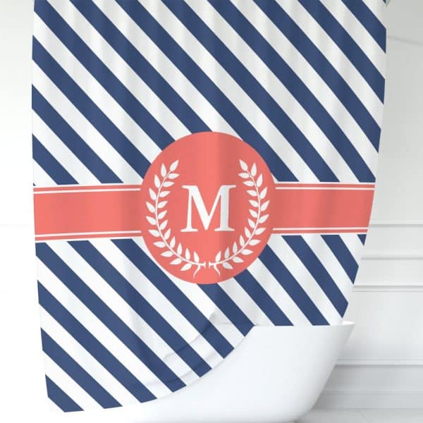 Navy And White Diagonal Striped Shower Curtain With A Coral Circle And Laurel Wreath Featuring The Letter M.