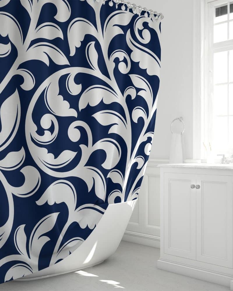 Navy blue shower curtain with a white damask pattern.