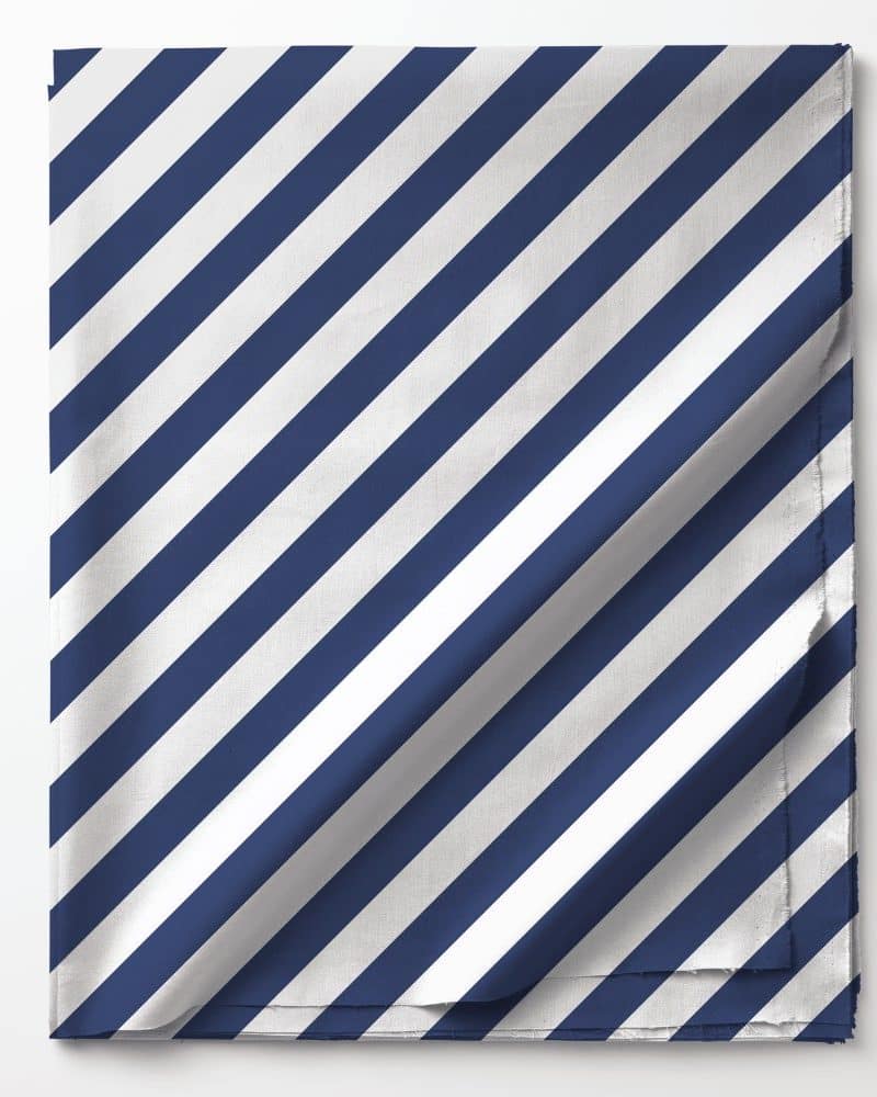 Folded fabric with diagonal navy blue and white stripes.