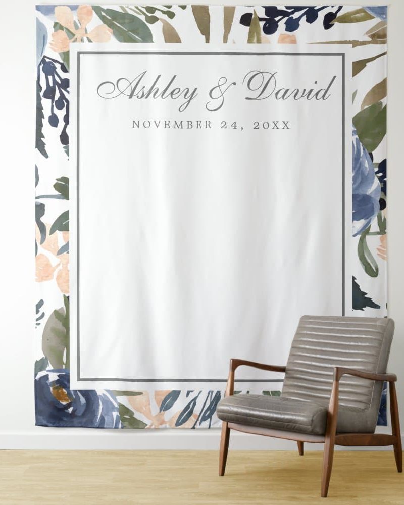 Wedding backdrop with floral border and Ashley & David's names and wedding date.