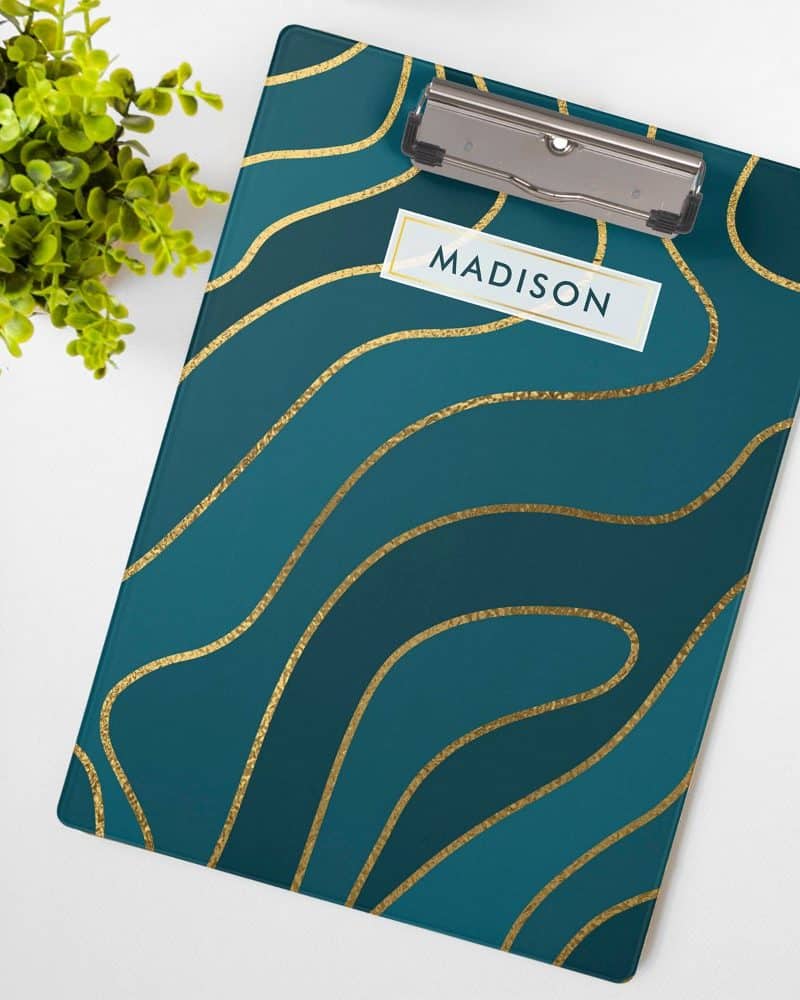 Teal clipboard with gold wavy lines and the name Madison.
