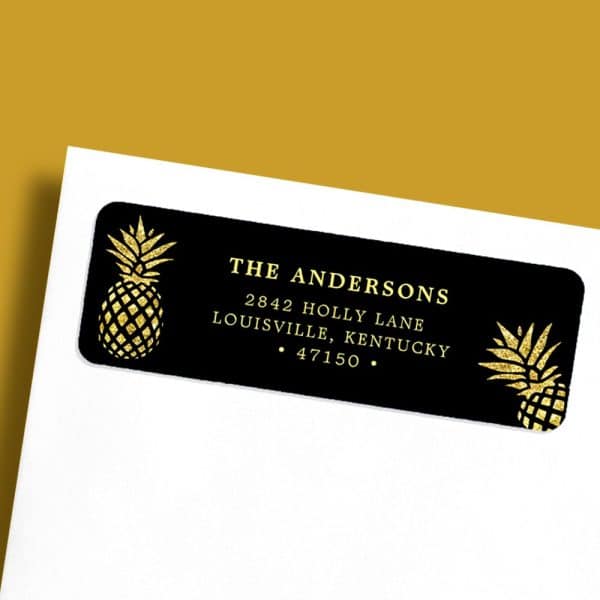 Black Return Address Label With Gold Glitter Pineapples And The Andersons' Address In Gold Lettering.