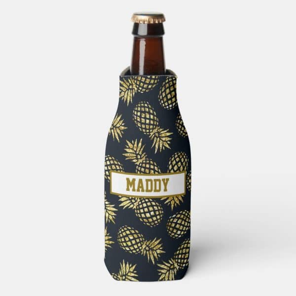 Bottle Koozie With A Dark Background And Gold Glitter Pineapples; Personalized With The Name Maddy.