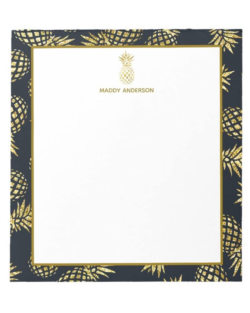 Personalized notepad with a dark blue border featuring gold glitter pineapples.