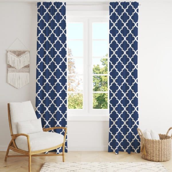 Navy Blue Curtains With A White Quatrefoil Pattern Hang On A Window.