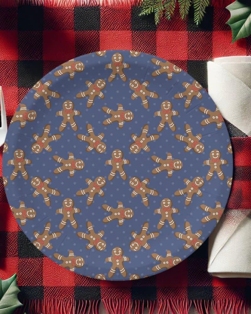 A blue paper plate decorated with a repeating pattern of gingerbread men.