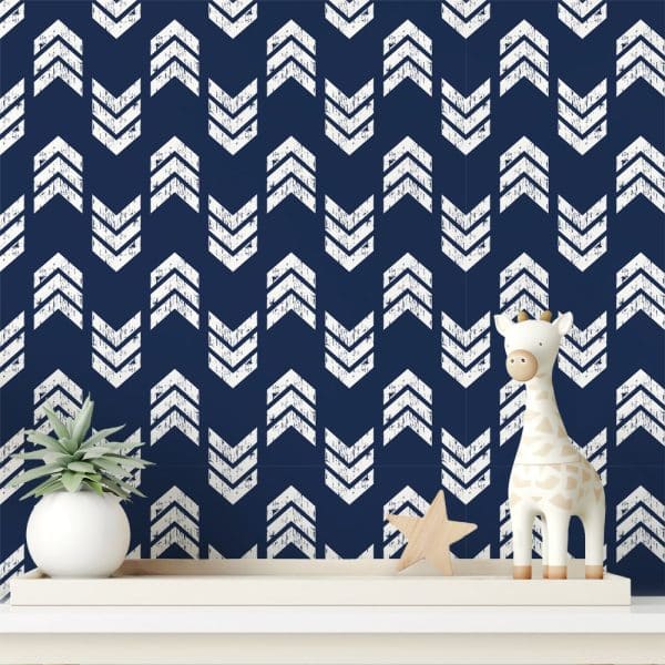 A Navy Blue Wall With A White Distressed Chevron Pattern.