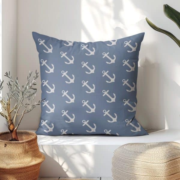 Blue Square Pillow With A Repeating Pattern Of White Anchors.