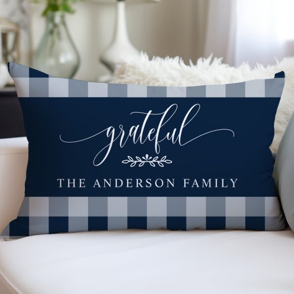Navy Blue And Gray Gingham Pillow With The Word Grateful In Elegant Script And The Anderson Family Name.