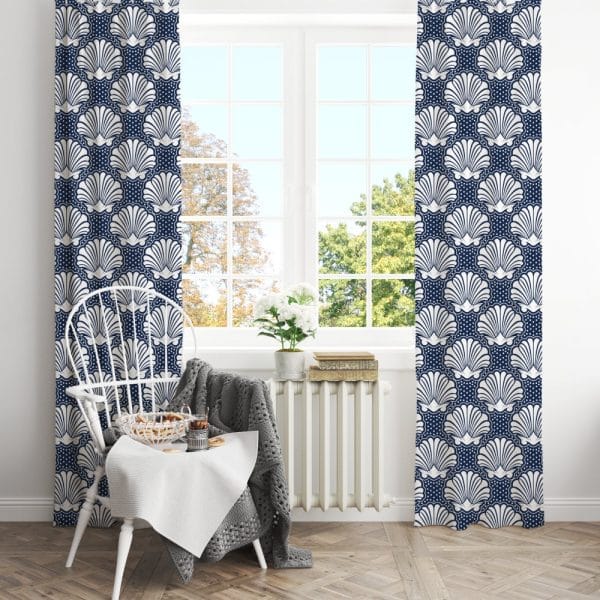 Navy Blue Curtains With A White Seashell Pattern Hang In A Window.