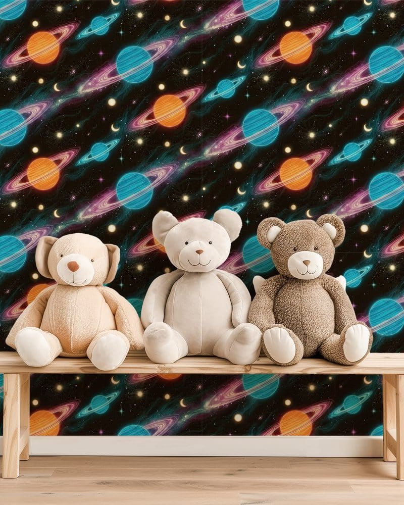 Three teddy bears sit on a wooden bench in front of a wall covered in a space-themed wallpaper.