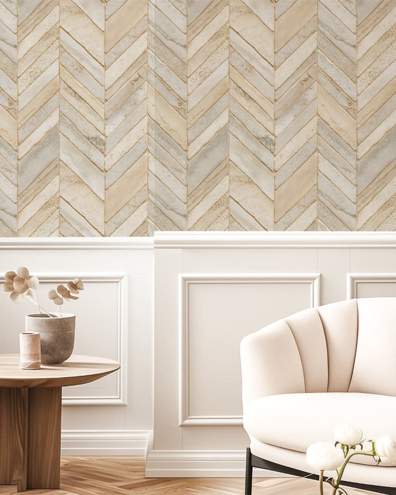 Beige and gray herringbone patterned wallpaper on a wall.