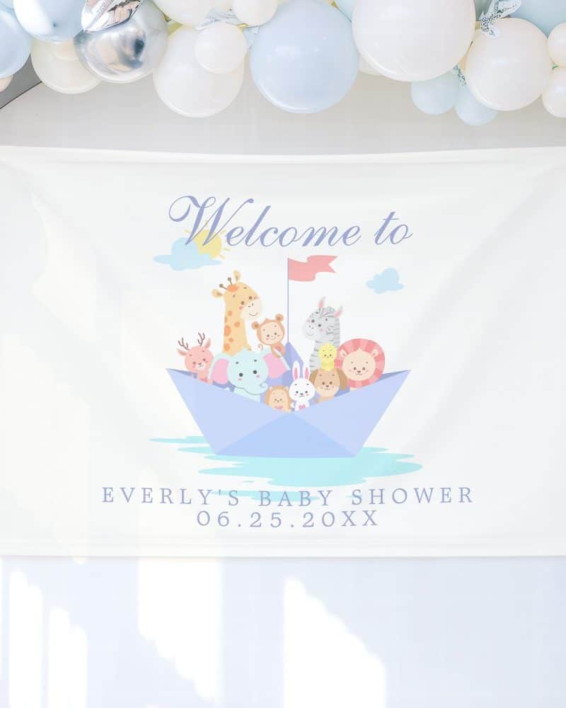 A white banner announces Everly's baby shower with the date, and features cartoon animals on a paper boat.