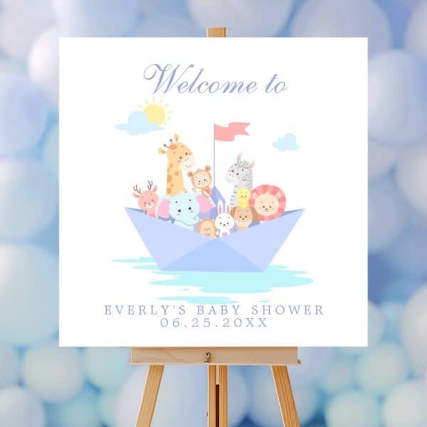 A Baby Shower Sign Featuring Various Cartoon Animals In A Paper Boat. The Sign Says Welcome To Everly'S Baby Shower.
