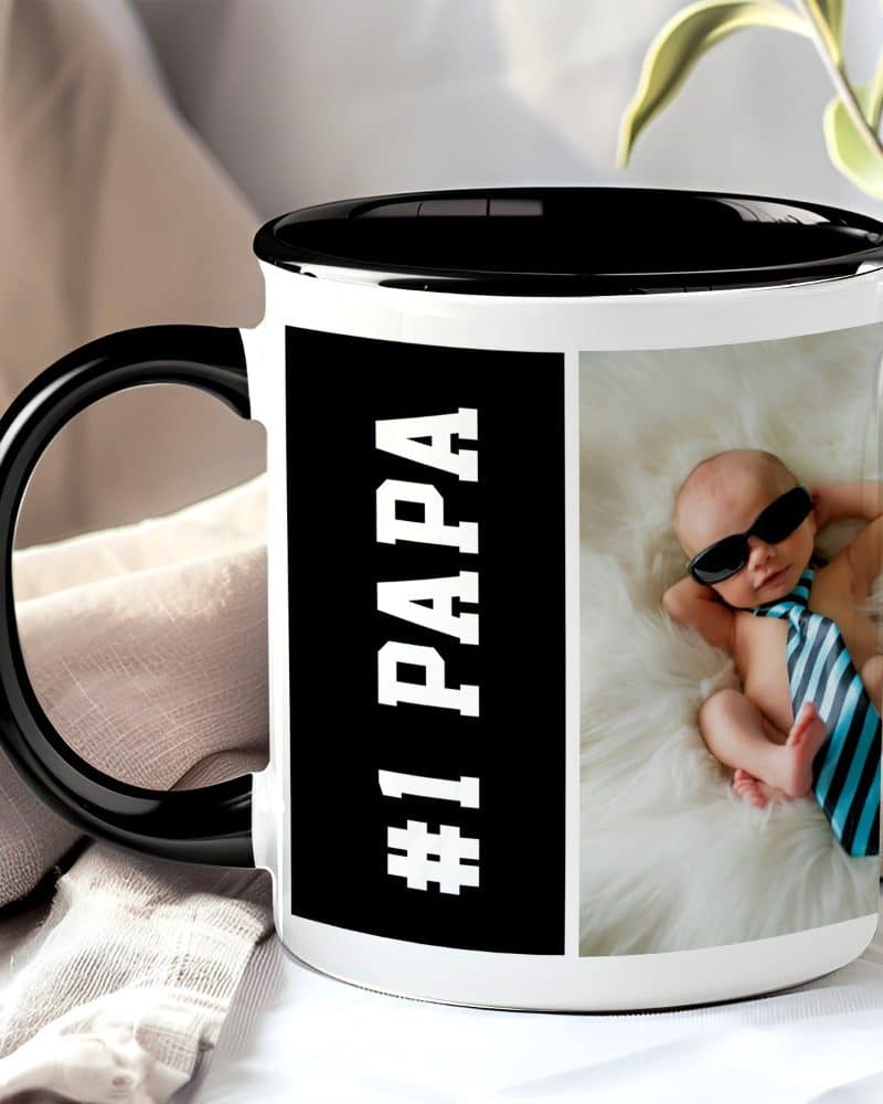 Black mug with a black rim, featuring the text #1 PAPA and a photo of a baby wearing sunglasses and a tie.