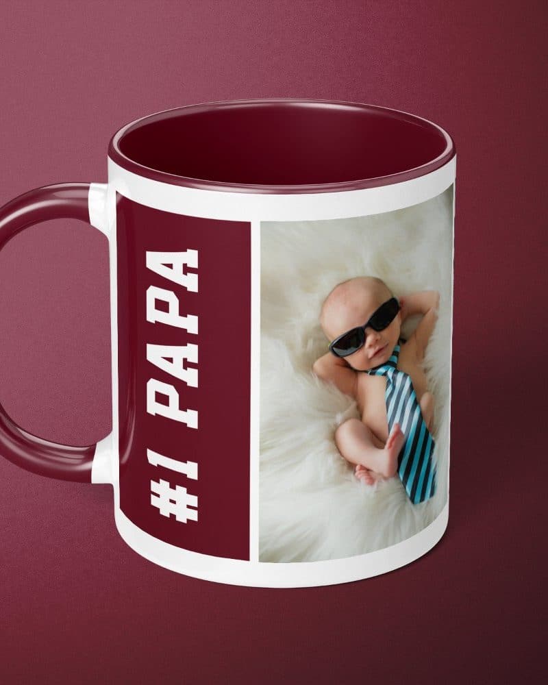 Burgundy mug with a photo of a baby wearing sunglasses and a tie; text reads #1 Papa.
