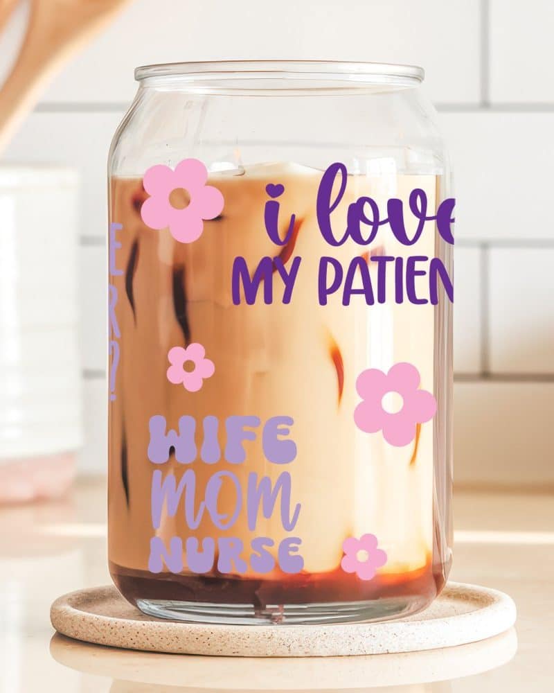 Glass iced coffee tumbler with text reading I love my patients, wife, mom, nurse and pink flowers.