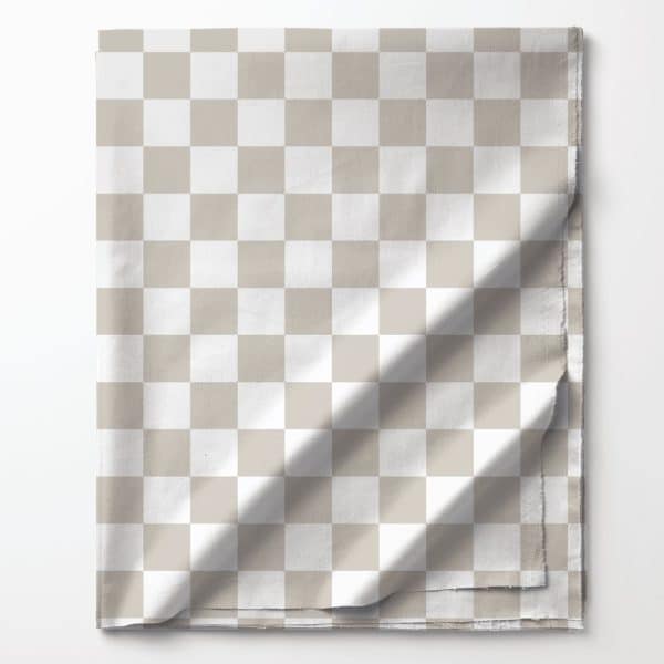 Beige And White Checkered Fabric Folded On A White Background.