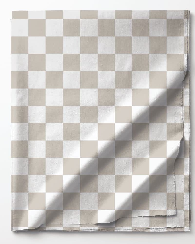 Beige and white checkered fabric folded on a white background.